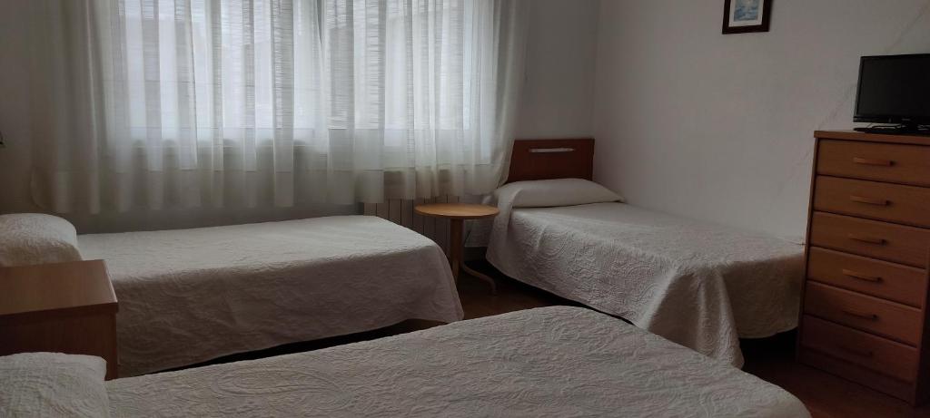 Postel nebo postele na pokoji v ubytování Hotel A Roda