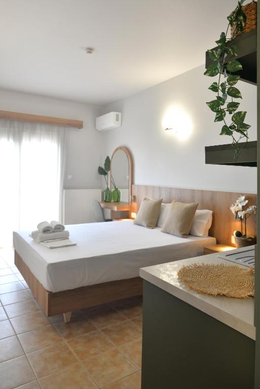 Postel nebo postele na pokoji v ubytování Hotel Akti