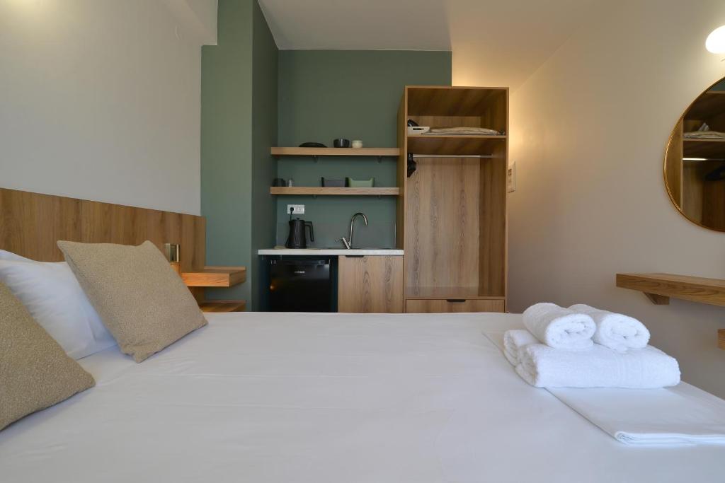 Postel nebo postele na pokoji v ubytování Hotel Akti