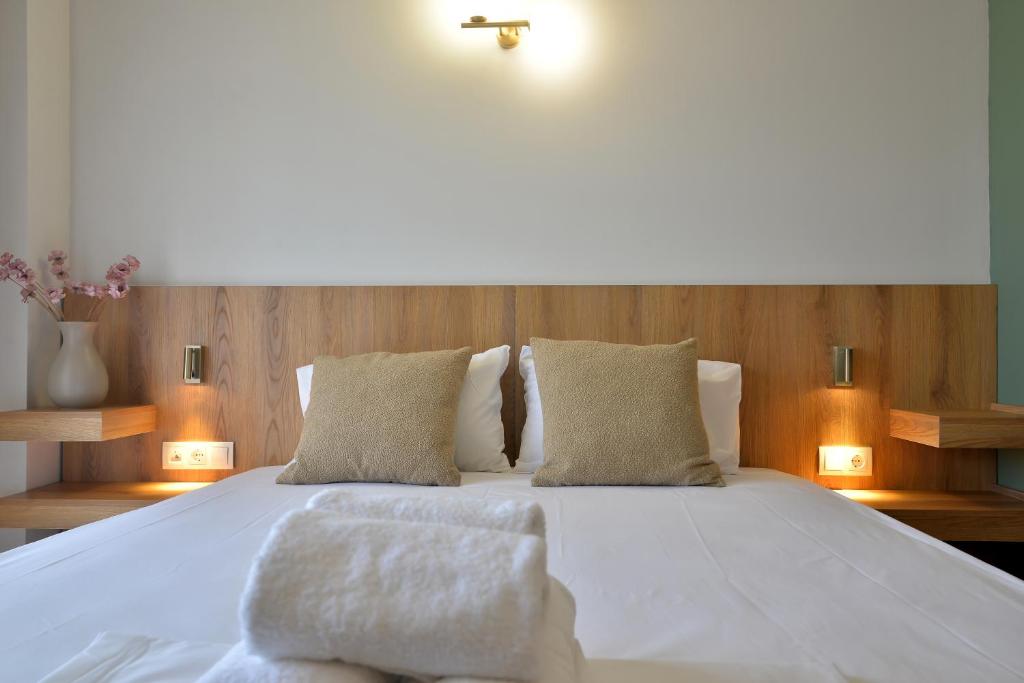 Postel nebo postele na pokoji v ubytování Hotel Akti