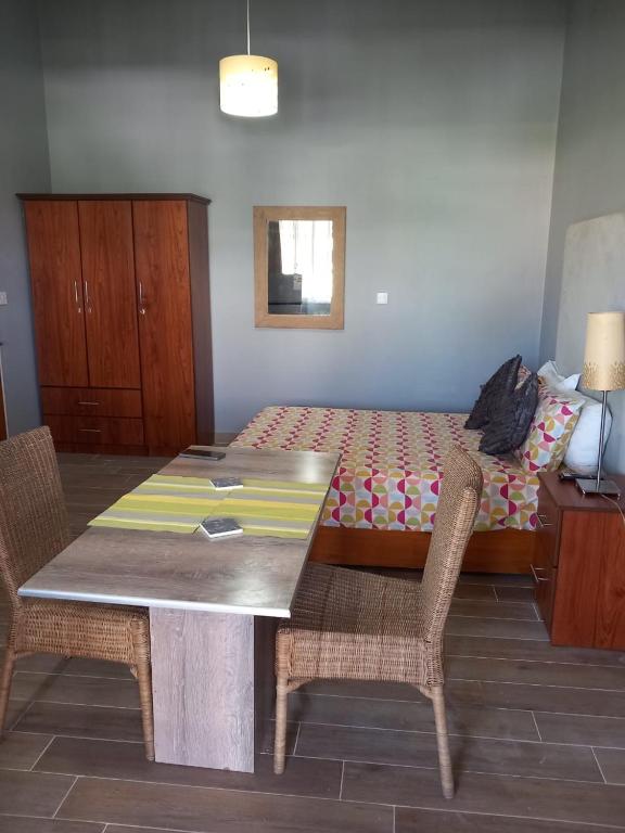 Postel nebo postele na pokoji v ubytování Sacha Tourist Residence 1