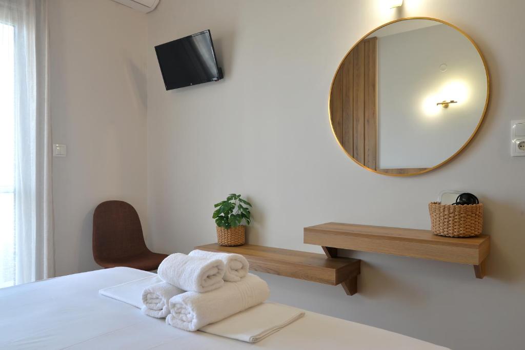 Postel nebo postele na pokoji v ubytování Hotel Akti