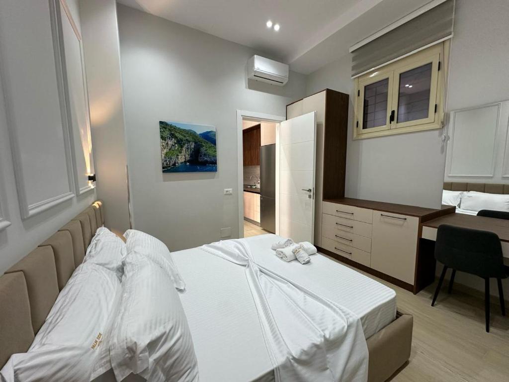 Letto o letti in una camera di Palm Side Hotel