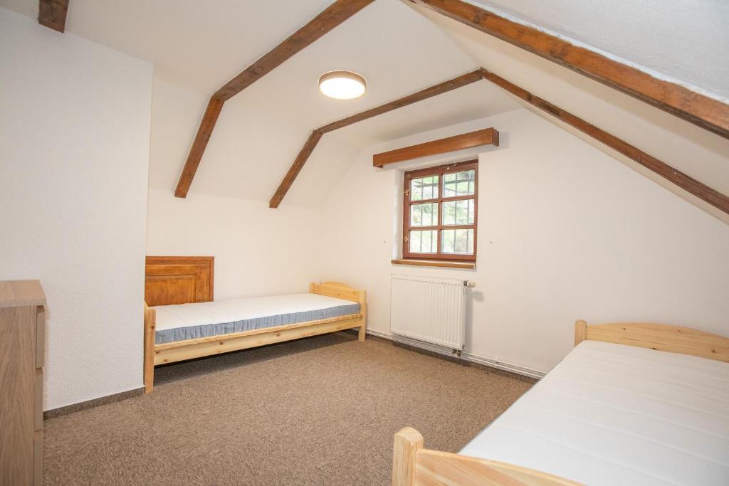 Postel nebo postele na pokoji v ubytování Resort U Jelena