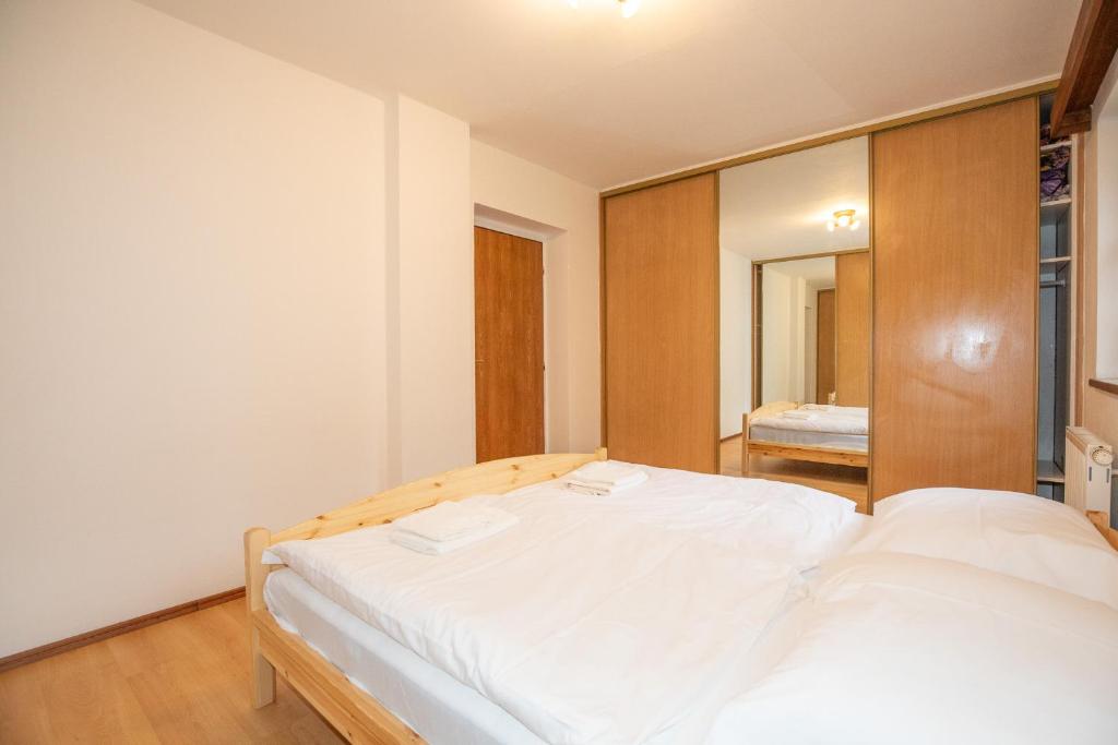 Postel nebo postele na pokoji v ubytování Resort U Jelena