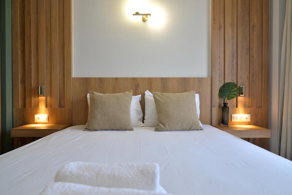 Postel nebo postele na pokoji v ubytování Hotel Akti