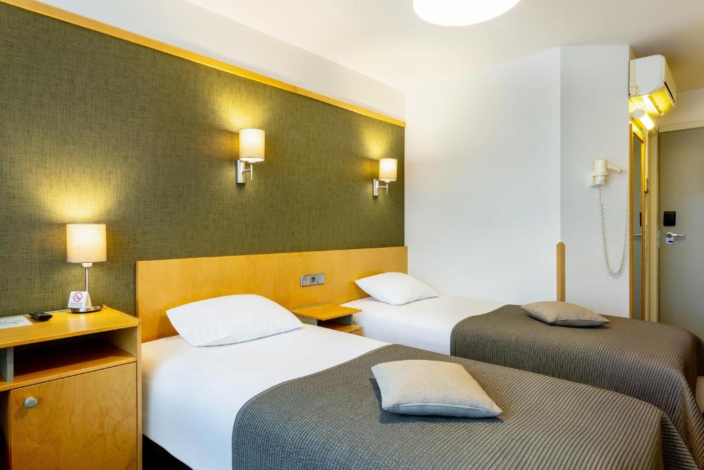 Postel nebo postele na pokoji v ubytování Hotel Tartu
