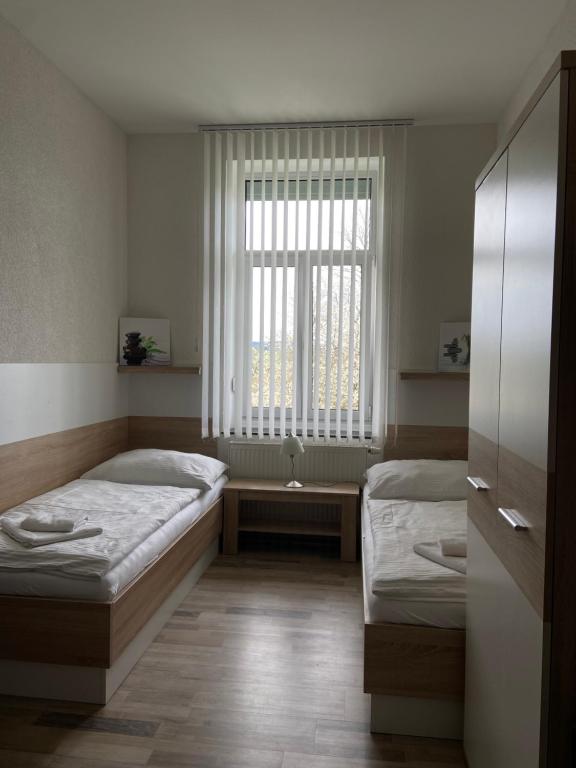 Postel nebo postele na pokoji v ubytování Penzion Obora