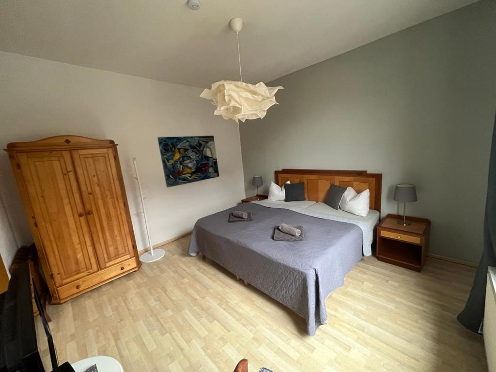 Postel nebo postele na pokoji v ubytování Art Apartment - Harz