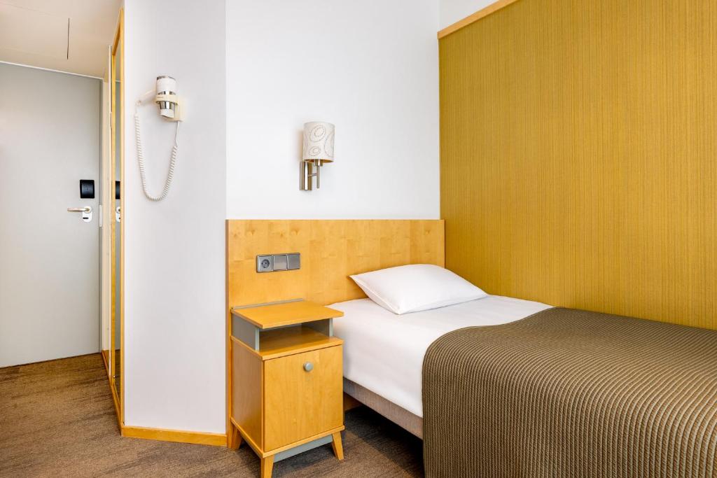 Postel nebo postele na pokoji v ubytování Hotel Tartu