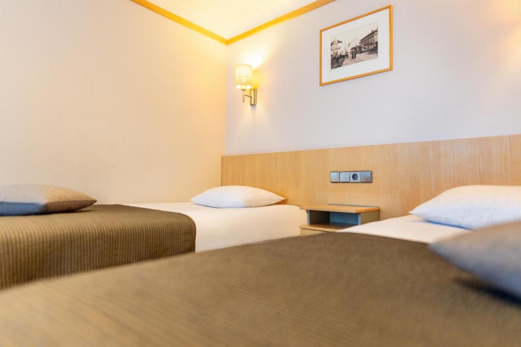 Postel nebo postele na pokoji v ubytování Hotel Tartu