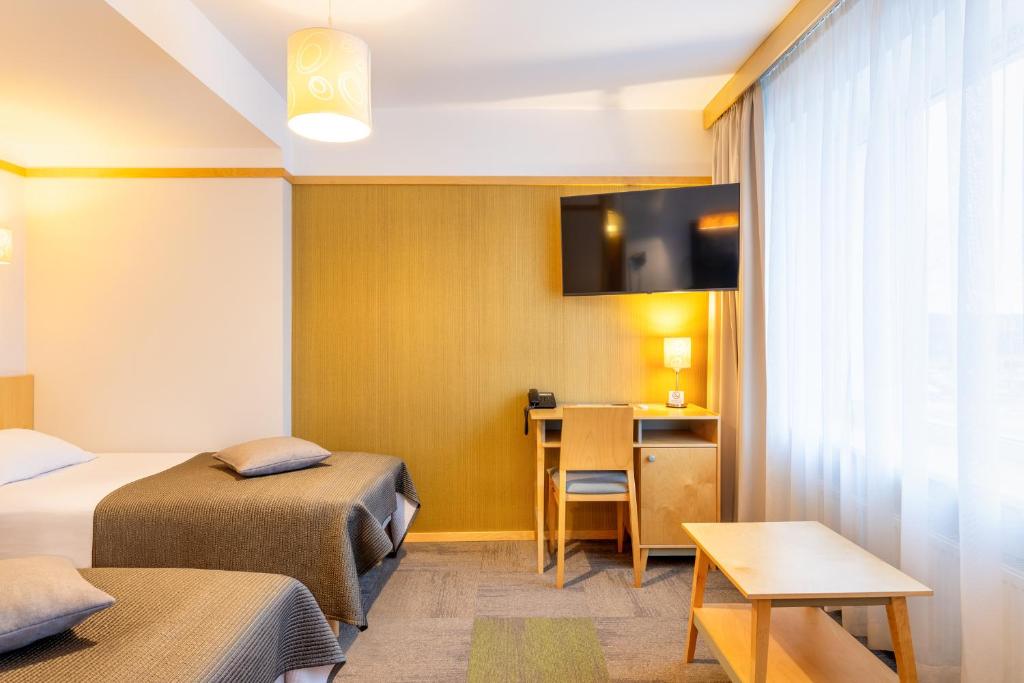 TV a/nebo společenská místnost v ubytování Hotel Tartu