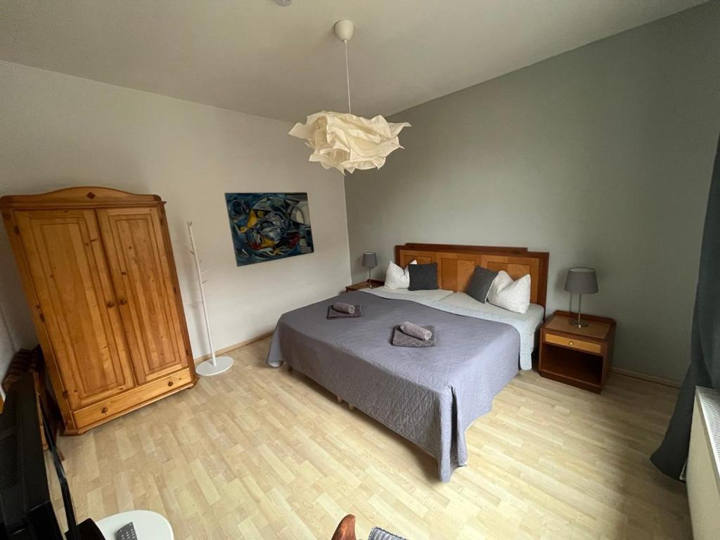 Postel nebo postele na pokoji v ubytování Art Apartment - Harz