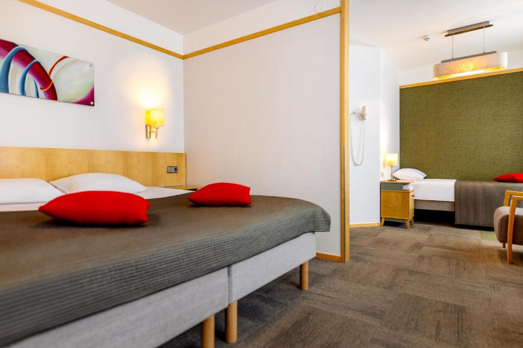Postel nebo postele na pokoji v ubytování Hotel Tartu