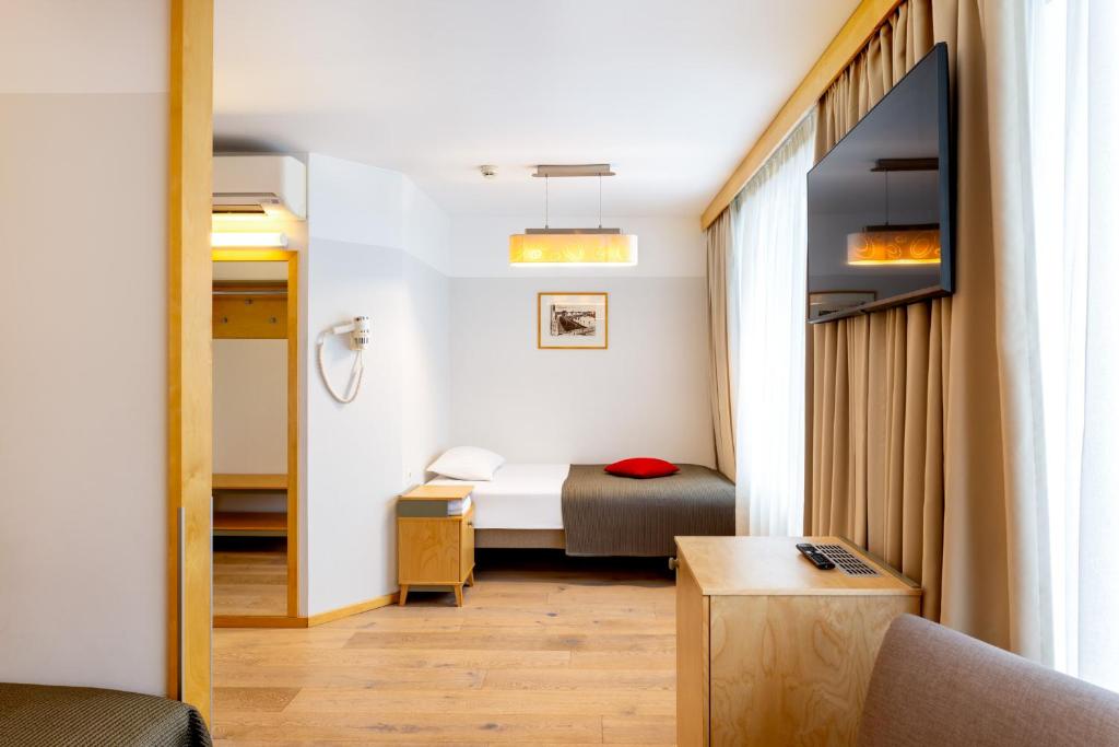 Postel nebo postele na pokoji v ubytování Hotel Tartu