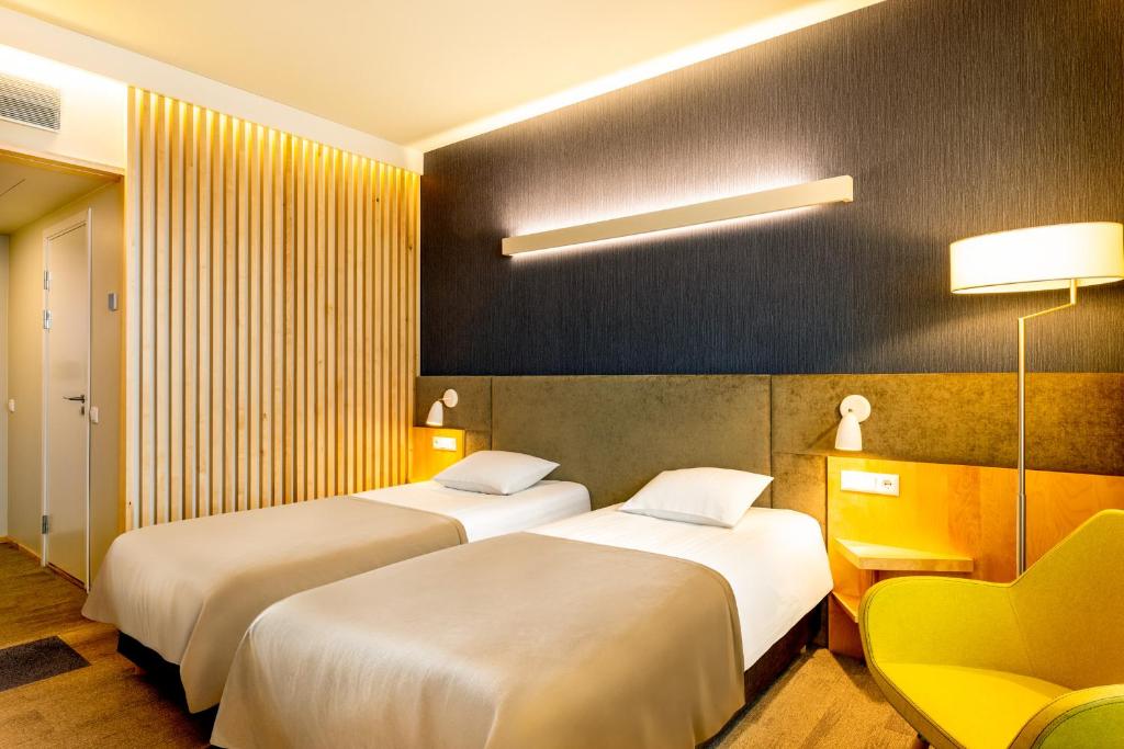 Postel nebo postele na pokoji v ubytování Hotel Tartu