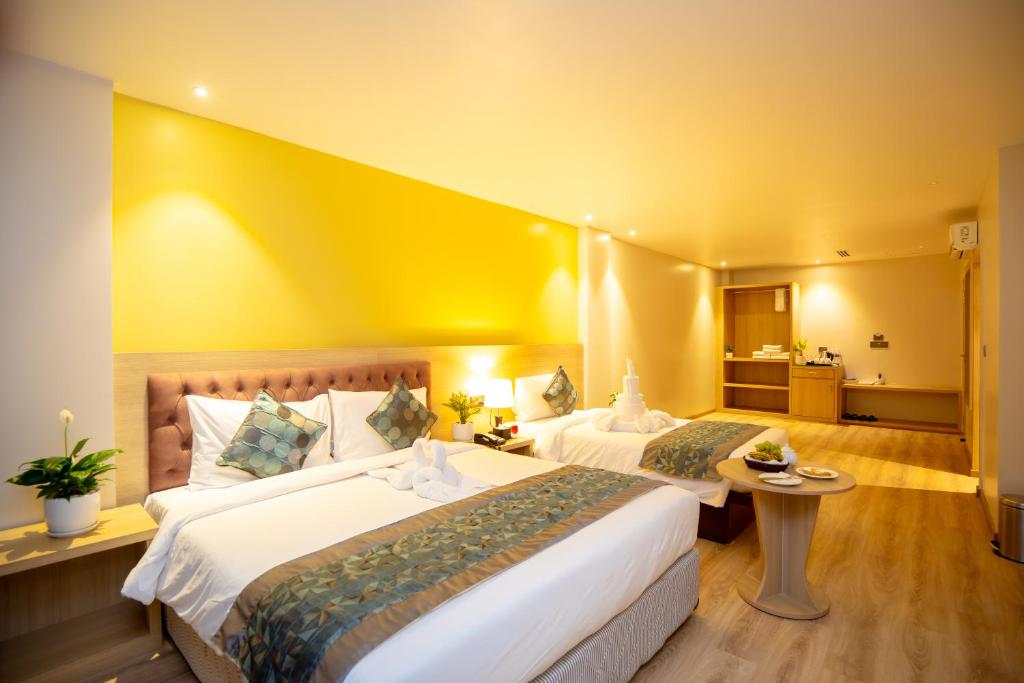 Postel nebo postele na pokoji v ubytování Velvet Luxe Hotel