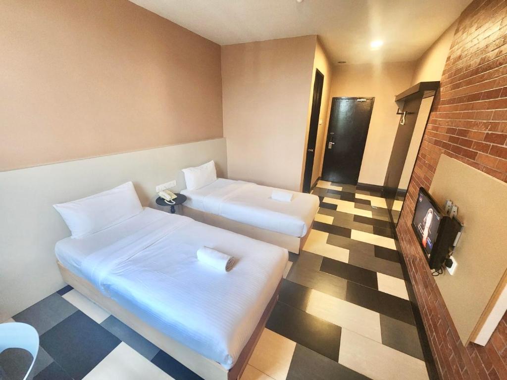 Postel nebo postele na pokoji v ubytování the youniQ Hotel, KLIA T1, KLIA T2