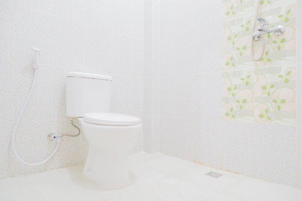 Koupelna v ubytování OYO 1519 Axl Residence