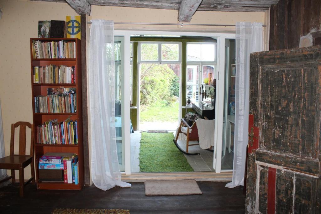 a room with a door open to a living room at Suur-Lossi Apartments in Haapsalu