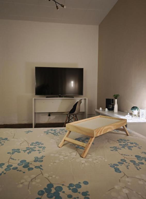 TV a/nebo společenská místnost v ubytování Suite Aurora