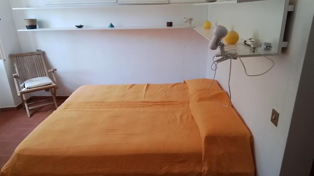 A bed or beds in a room at Appartamento località le Cannelle