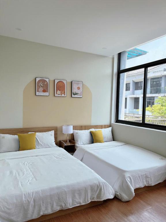 Postel nebo postele na pokoji v ubytování Minh Anh Villa & Apartment