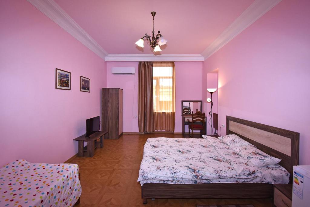 Postel nebo postele na pokoji v ubytování Villa Rosa