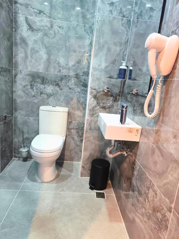 Koupelna v ubytování Spinola Hotel