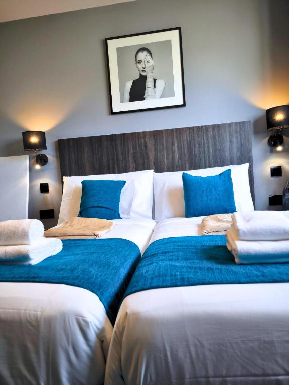 Postel nebo postele na pokoji v ubytování Spinola Hotel