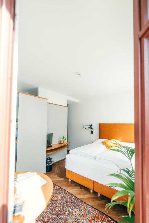 Postel nebo postele na pokoji v ubytování Consum Boutique Hotel