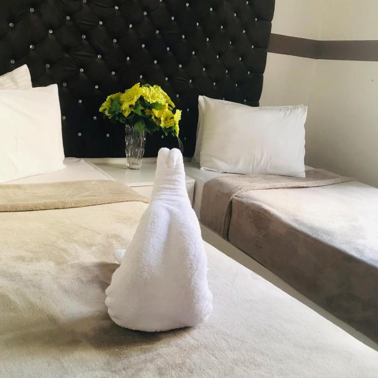 Postel nebo postele na pokoji v ubytování Hotel velvet One