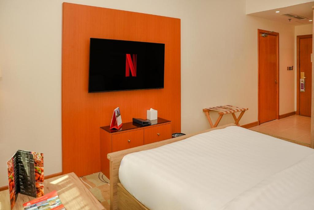 Televízia a/alebo spoločenská miestnosť v ubytovaní Swiss-Belinn Doha
