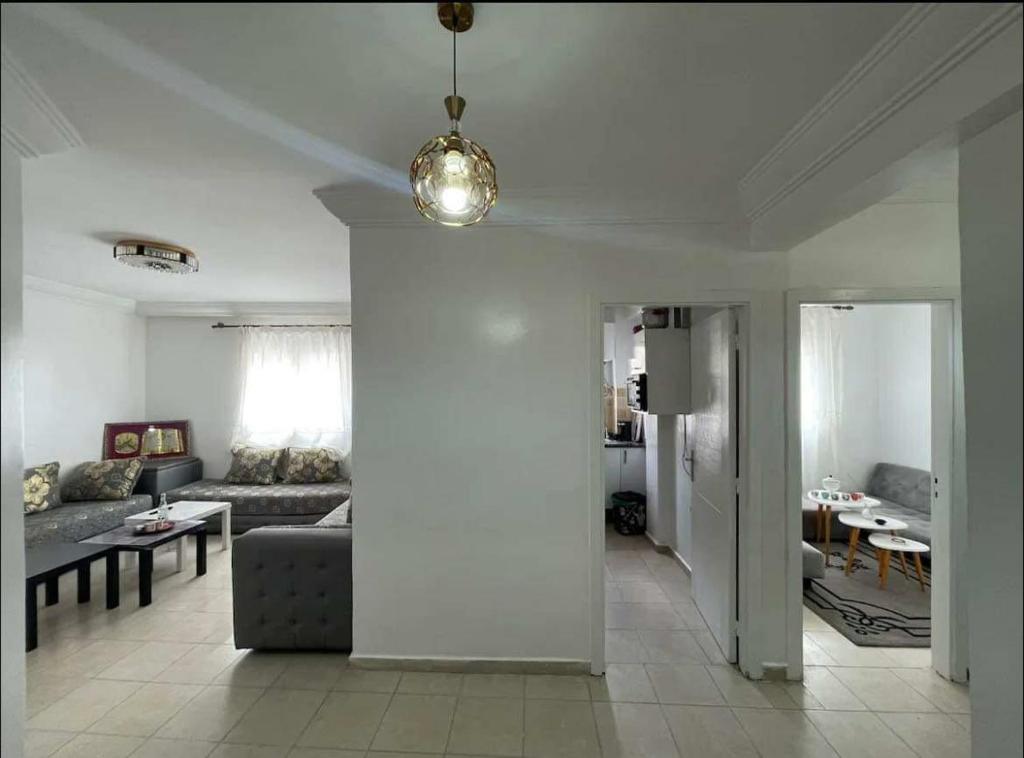 a living room with a couch and a table at Confortble 2Bedroom in Downtown in El Jadida