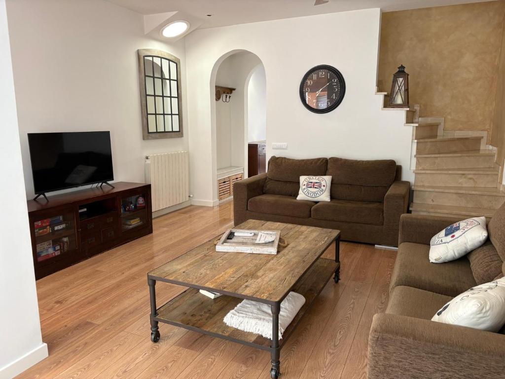 TV a/nebo společenská místnost v ubytování Casita de la playa con parking