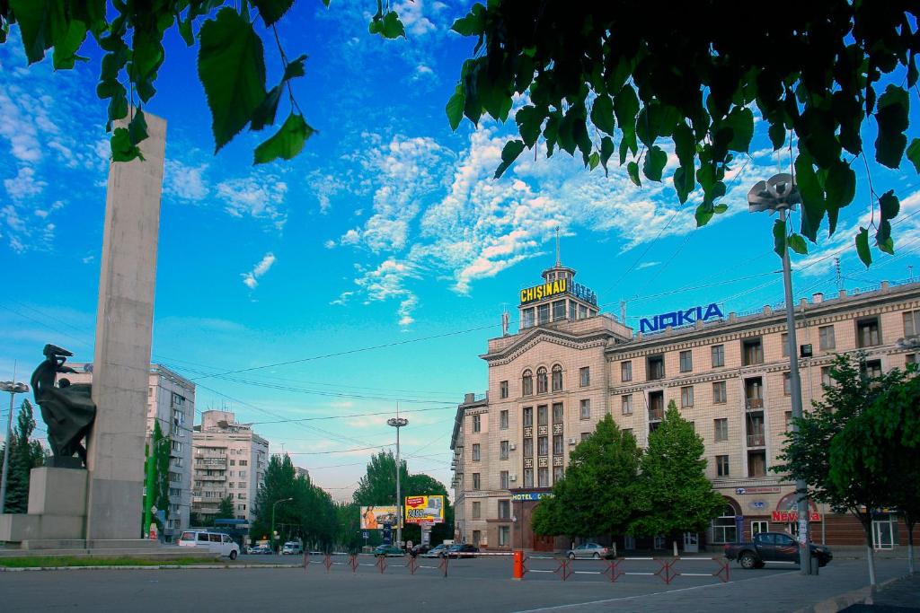 a large building with a nasa sign on top of it at Chisinau Hotel in Chişinău