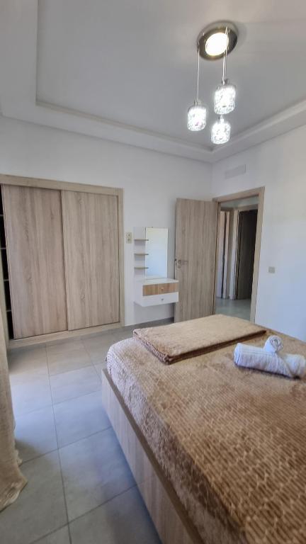 Postel nebo postele na pokoji v ubytování Appartement luxueux - Piscines, Plage 300m, Résidence fermée