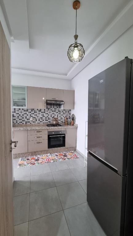 Kuchyň nebo kuchyňský kout v ubytování Appartement luxueux - Piscines, Plage 300m, Résidence fermée