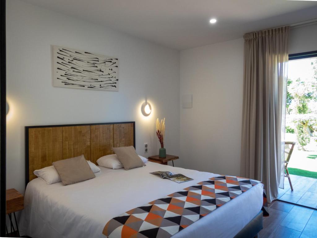 Postel nebo postele na pokoji v ubytování Hôtel Padolo
