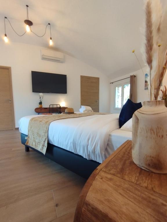 Postel nebo postele na pokoji v ubytování Hôtel Padolo