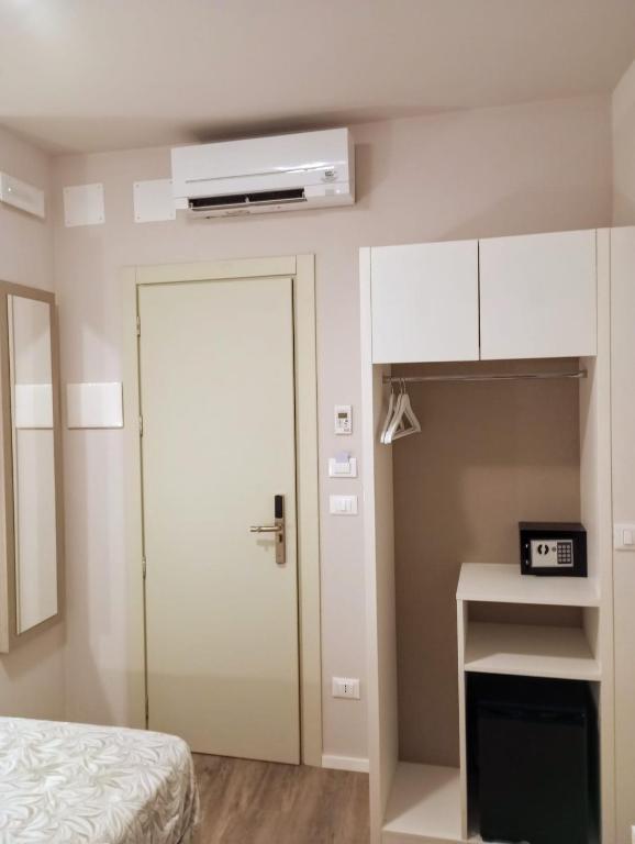 Postel nebo postele na pokoji v ubytování Hotel Acquario