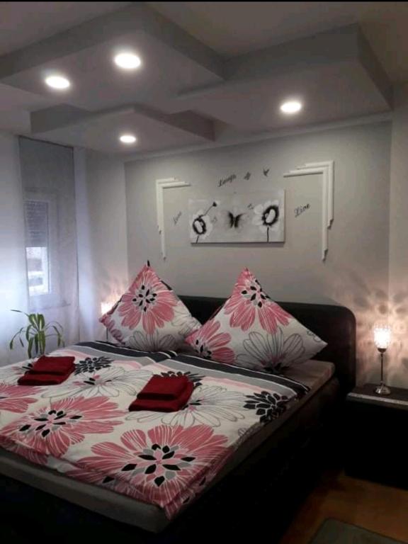 a bedroom with a bed with pillows on it at Apartment Bella Italia in Cologne