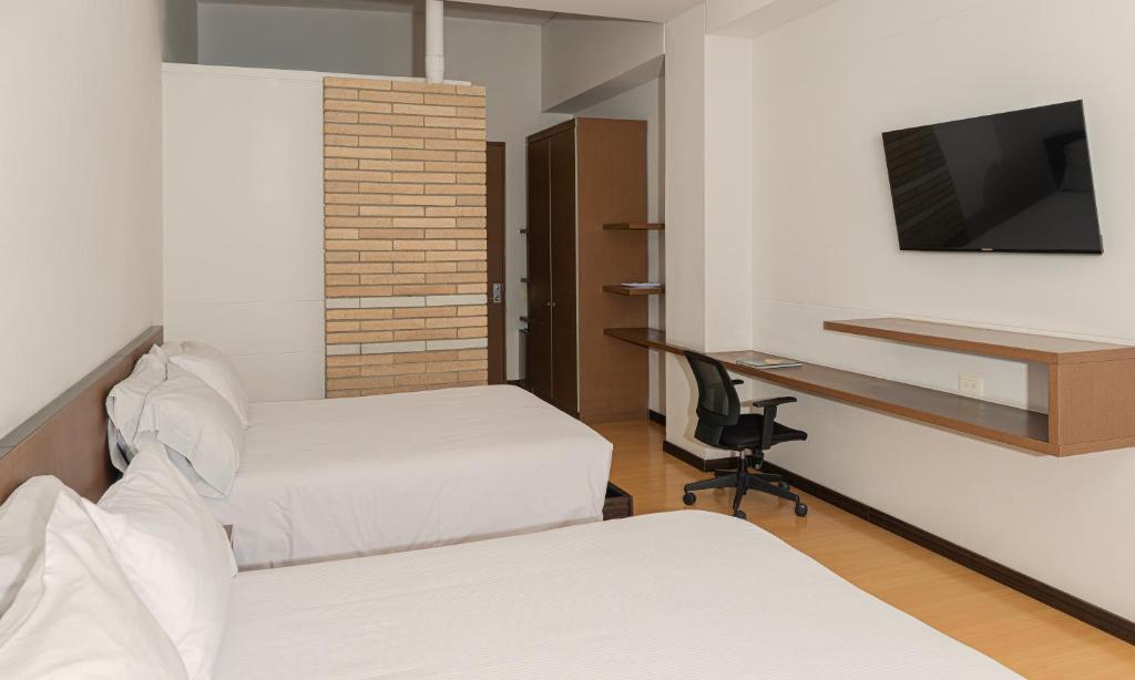 TV a/nebo společenská místnost v ubytování Hotel Viaggio Nueve Tres