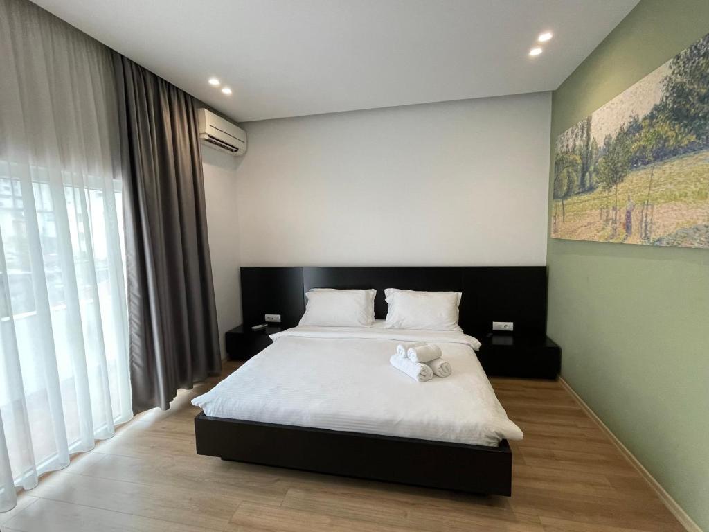 Postel nebo postele na pokoji v ubytování Ladi Rooms