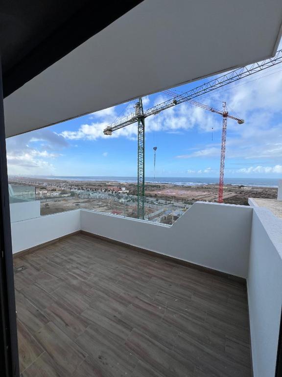 a view from a building under construction with cranes at Ocean park zenata in Aïn Harrouda