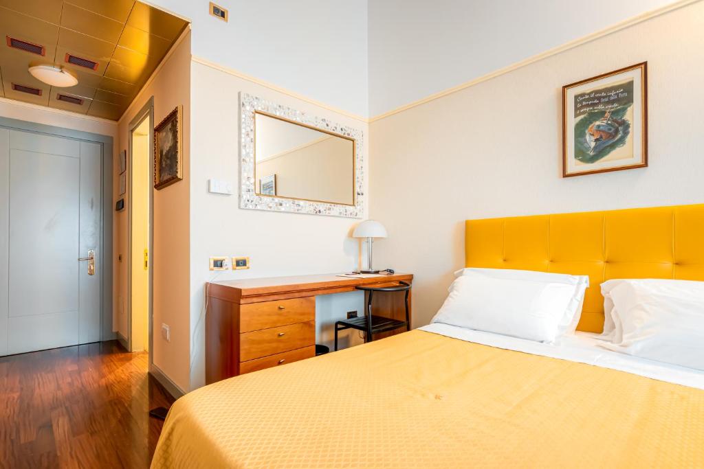 Postel nebo postele na pokoji v ubytování Hotel Della Porta