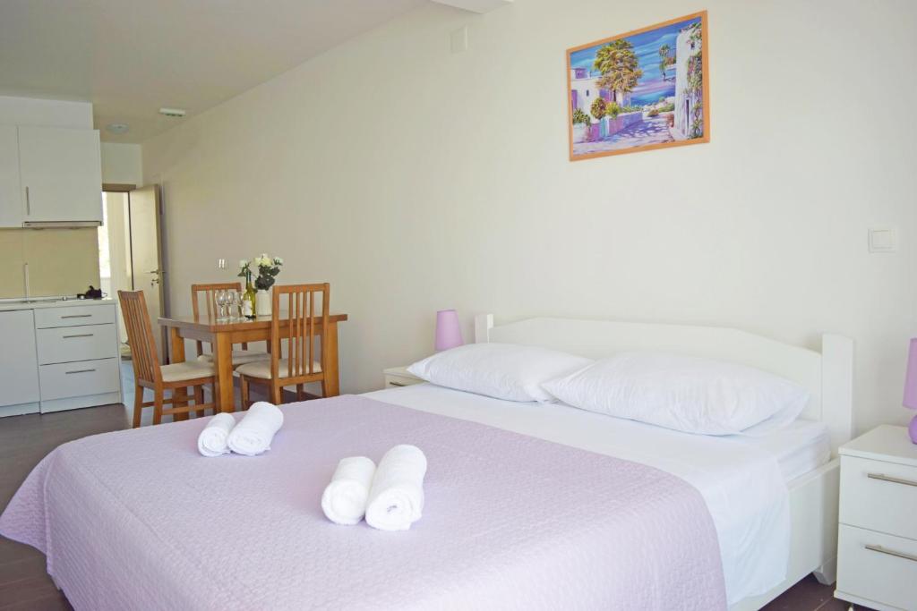 Posteľ alebo postele v izbe v ubytovaní Apartments King