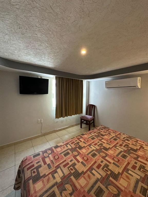 Postel nebo postele na pokoji v ubytování Hotel Impala Veracruz