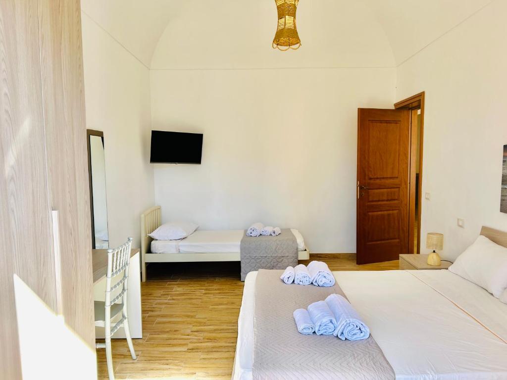 Postel nebo postele na pokoji v ubytování Spazioso Appartamento da Maria