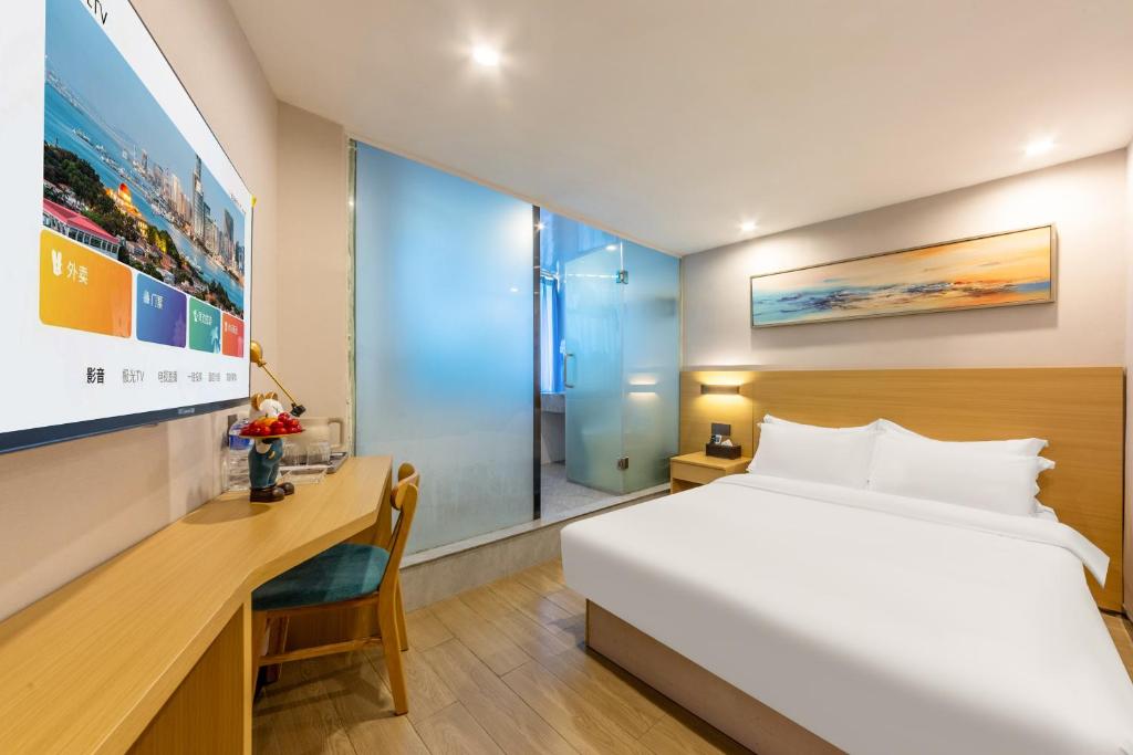 Postel nebo postele na pokoji v ubytování CMAX Hotel Guangzhou International Convention and Exhibition Center Luoxi Subway Station Branch